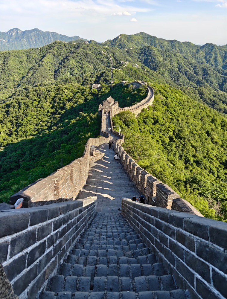 The Mutianyu Great Wall winding over green mountains