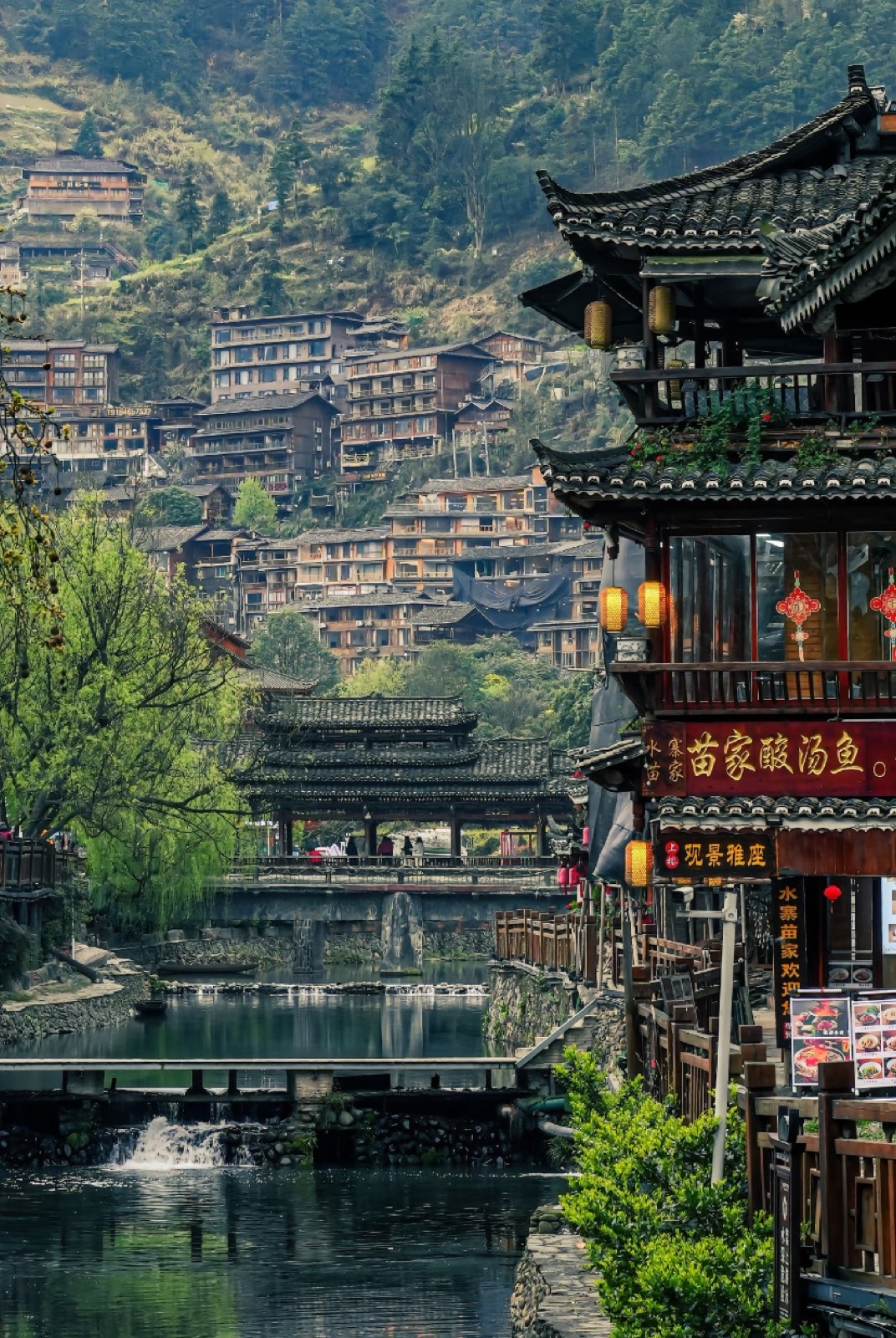 Riverside old town with wooden stilt houses and lanterns