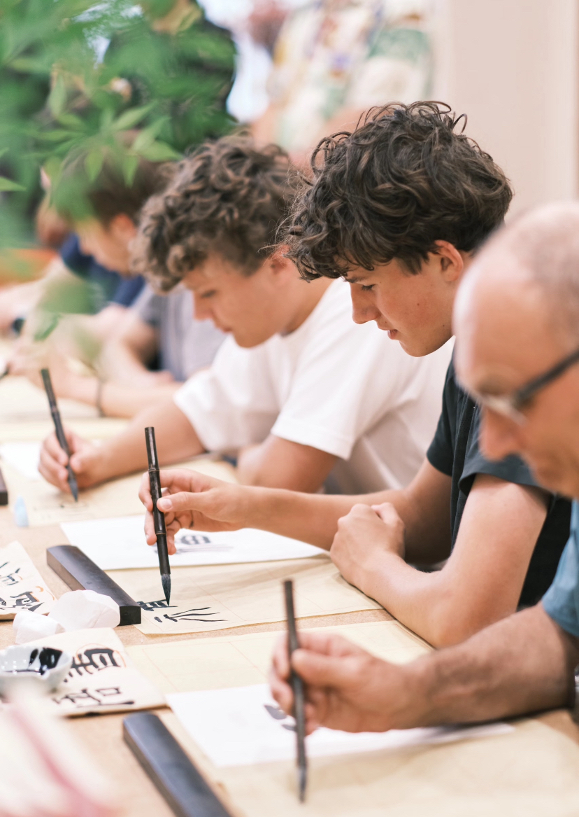 A hands-on Chinese calligraphy session with brush and ink