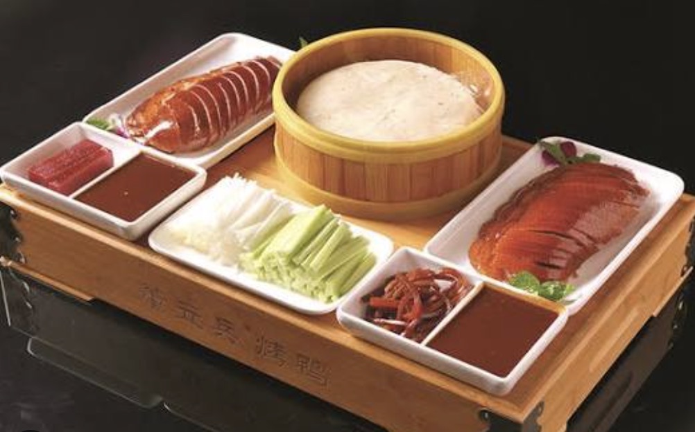 A halal Beijing-style roast duck dinner served at a table