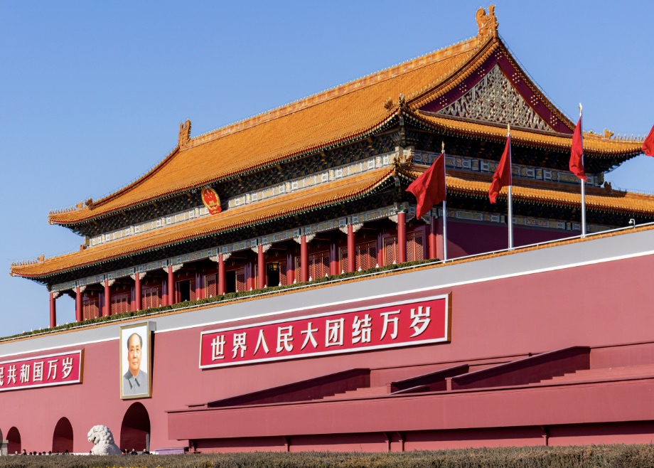 A traveller arriving at a modern Beijing airport terminal in winter