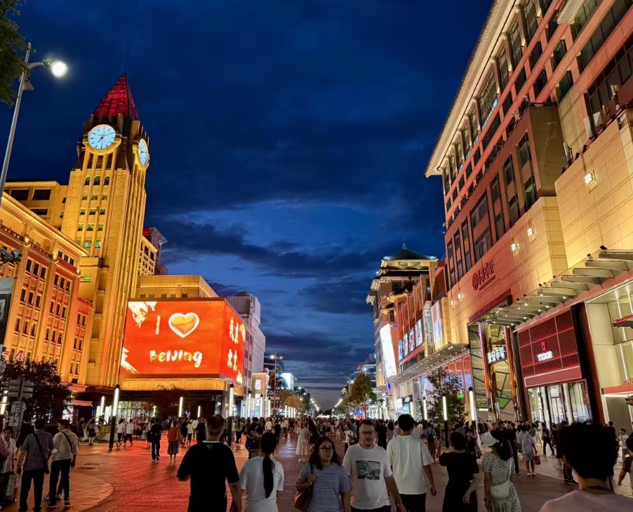 Busy Wangfujing shopping street in Beijing with shops and crowds
