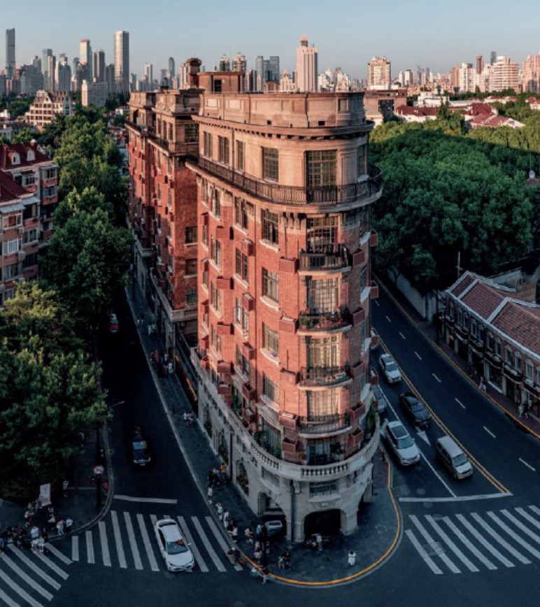 Tree-lined Wukang Road in Shanghai's former French Concession, with historic architecture and a relaxed streetscape