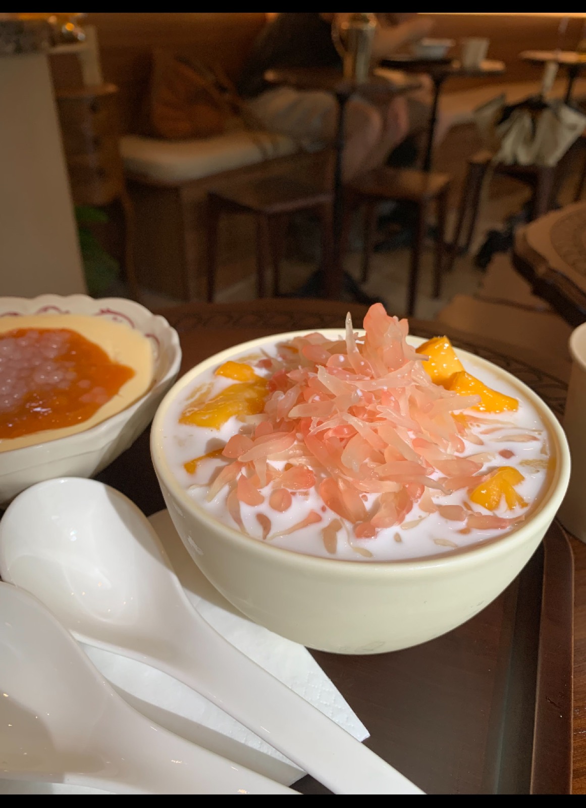 A bowl of mango and pomelo over chilled sago cream