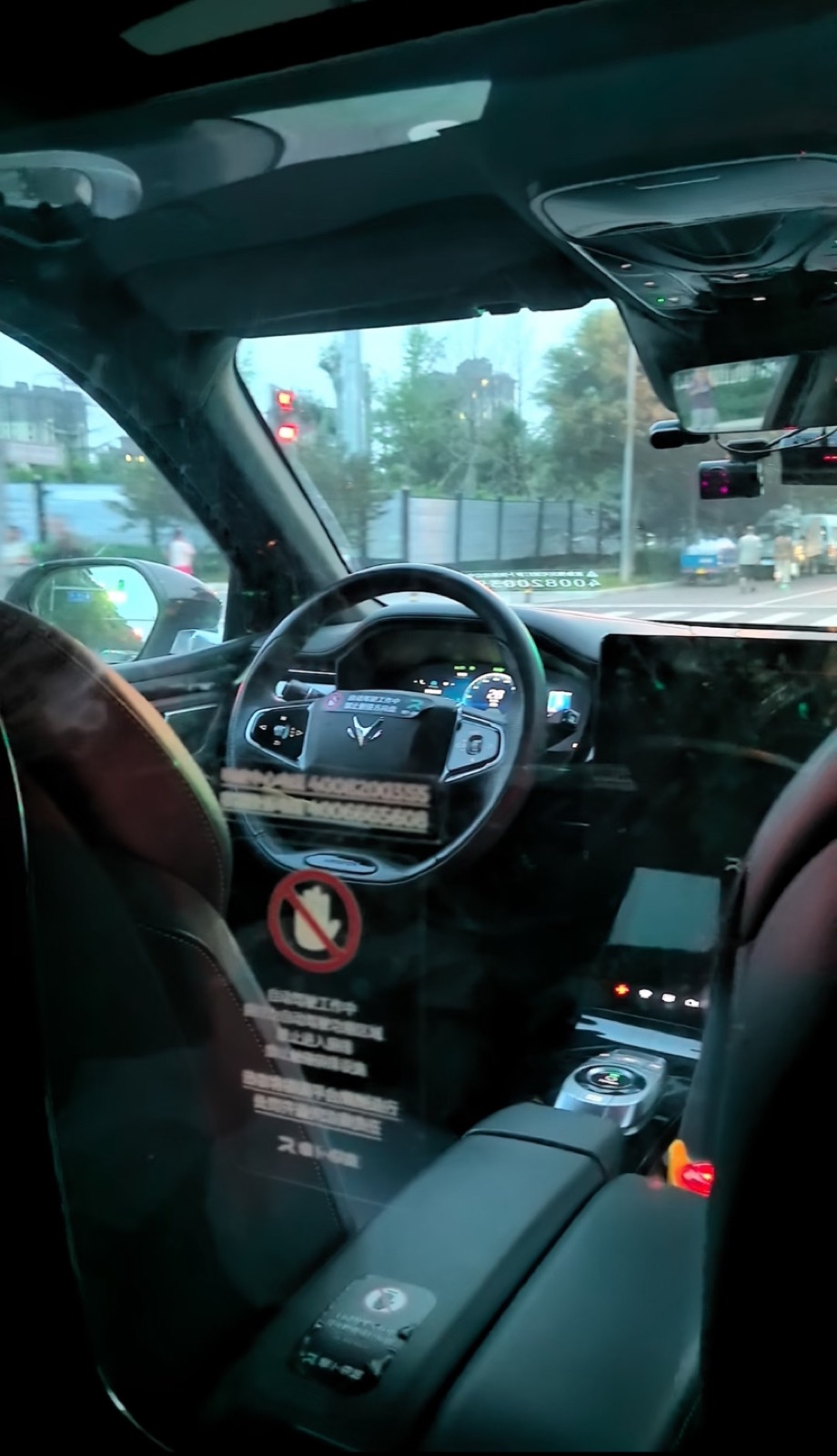 Inside a driverless smart car with the steering wheel turning on its own