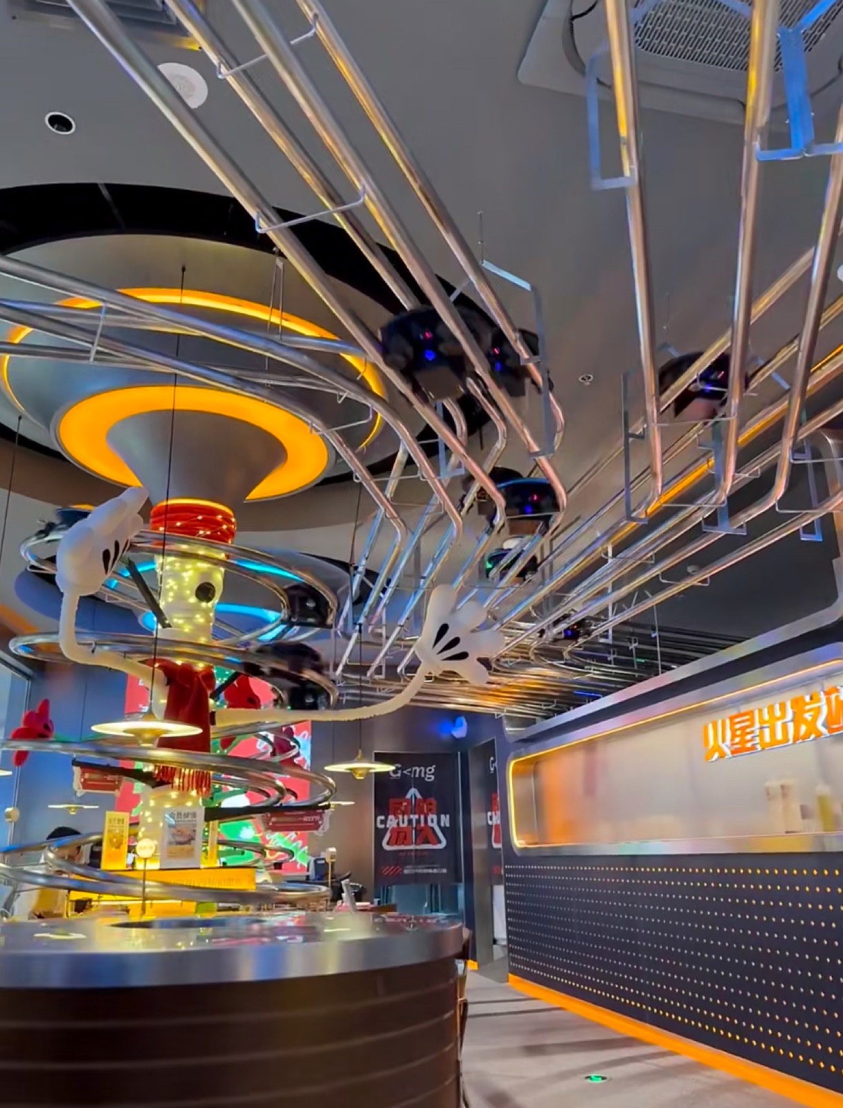 The neon spiral tracks and futuristic interior of a high-tech Shanghai restaurant