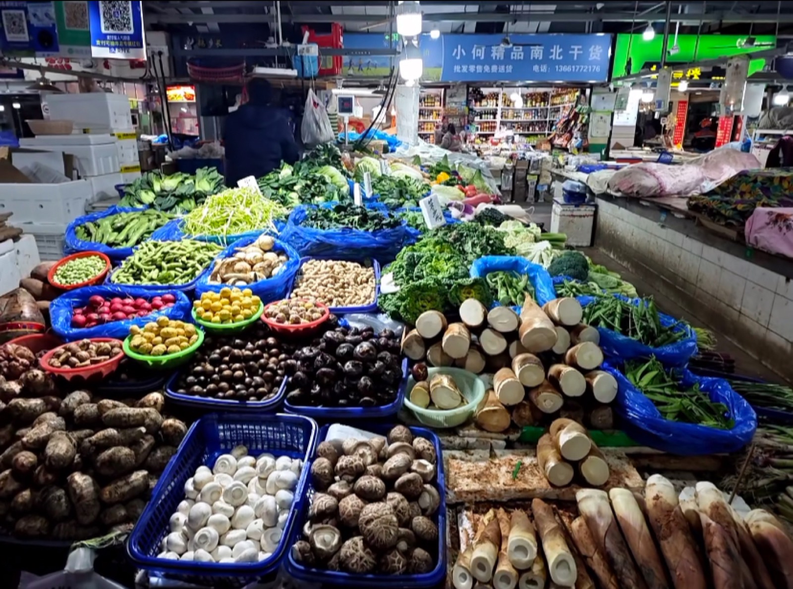 Colourful stalls of produce and mushrooms at a Shanghai wet market