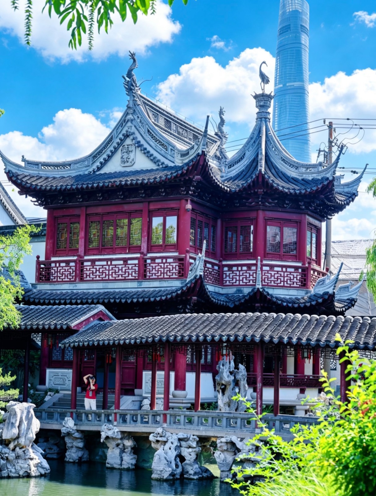 A classical Yu Garden pavilion with the Shanghai Tower rising behind it