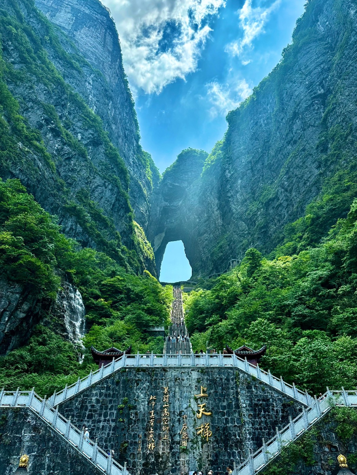 The stone arch of Heaven's Gate and its stairway carved into Tianmen Mountain